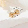 Macro detail of 14K gold plated pearl clasp with zircon inlay measuring 20mm x 8.6mm - 14K Gold H-8844 Mini Zirconia