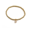 Gold beaded star charm bracelet with zircon inlays for women on white background - Star Pendant