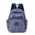 Deep blue nylon backpack with pink floral pattern and multi-pocket design for travel - Pink Crown