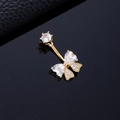 Gold-plated navel ring featuring a sparkling zircon butterfly design on a dark background - Heart Butterfly Gold