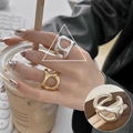 Minimalist fluid art open ring in gold and silver finish with irregular cutout design - Irregular Hollow Art