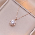 Elegant rotating flower necklace in rose gold finish with heart-shaped crystal petals - X3053 Rose Gold Heart Rotating