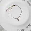 Minimalist 18K gold plated bracelet featuring a sparkling zircon initial V pendant charm - Letter V