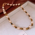 Detail of cream pearls and brown tiger eye stone necklace with gold-plated ring clasp - Necklace - Coffee (Gold Plated)