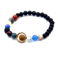 Detail view of solar system lava rock bracelet with planet beads and golden Saturn ring - 6+8mm Lava Stone Solar System Bracelet