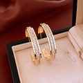 Macro view of gold hoop earrings with baguette-cut zircons in a jewelry box - 20# Golden Row Pave Baguette Zircon Hoop Earring