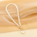 Detail of a pearl necklace with a heart-shaped crystal pendant on golden silk fabric - 1# Pearl White Shell