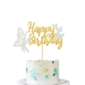 Glittery Happy Birthday cake topper with butterflies and leaves on white cake - White