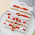Detailed set of 7 red, white, and gold football-themed bracelets with football charms - SY0689 Red White Gold 7pcs Set