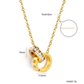 Detail of 18K gold double interlocking rings necklace with crystals and Roman numerals - Double Interlocking Rings Roman Numerals