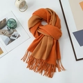 Orange and camel double-sided scarf with tassels displayed in a lifestyle setting - 200*68CM / Orange