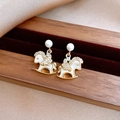 Exquisite gold-plated rocking horse stud earrings with white enamel and shimmering crystals - Gold