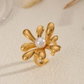 Elegant 18K gold plated flower ring with a white pearl center on a textured background - Irregular Multi-petal Pearl Ring