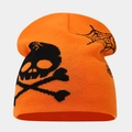 Detail of orange knitted beanie featuring a black skull and spider web Halloween motif - Style E Orange (Skull Pumpkin Orange)