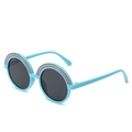 Cute round kids sunglasses with light blue frames and colorful rainbow accents on top - Blue