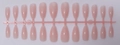 Macro detail of 24 pieces almond shape solid color press-on nails in jelly pink finish - Translucent Milky Pink (SD-08)
