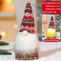 Detail of LED Christmas gnome with red knitted hat and wood base, 16cm height dimensions - Glowing Ornament 302-A