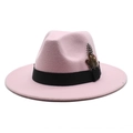 Detailed close-up of light pink wool fedora hat featuring black ribbon and pheasant feather - Pink