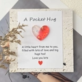 Macro shot of gradient glitter resin heart attached to a Pocket Hug greeting card - White Red