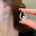 Close-up of silver textured hoop earrings with white pearls worn by a female model - 29# Ear Buckle-Silver