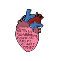 Cartoon anatomical heart enamel brooch with medical theme quote on white background - Medical Quote Anatomical Heart