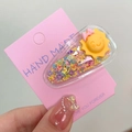 Glittering star sequins hair clip with cartoon sun and pink bow on a display card - Sun