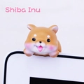 Close-up of a Shiba Inu mini ornament hanging on a screen edge for car or desk - Shiba Inu Monitor Hanger