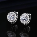 Macro view of silver round stud earrings with brilliant zircon stones on black background - Round Halo Dangle Earrings (ED47)