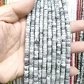 Macro detail of natural grey marble stone cylinder beads with unique marbled textures - Map Stone