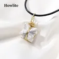 White turquoise Merkaba star necklace with gold wire wrap and black woven cord - Howlite