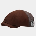 Detail of coffee newsboy cap featuring breathable mesh panels and vintage woven side label - Adjustable / Coffee