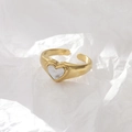 Gold-finished adjustable ring featuring a heart-shaped mother-of-pearl inlay on white background - US 7 / 14K Gold