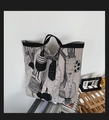 Minimalist canvas tote bag featuring black vegetable illustrations and black strap handles - Grey Radish