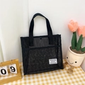 Portable black mesh tote bag with snap button closure for beach or travel - Black