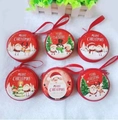 Set of six round Christmas tinplate coin purses with festive cartoon patterns and red lanyards - Round Christmas C