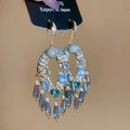 Close-up of elegant gold and blue teardrop tassel earrings with vintage zircon details - Ear Hook Style / Gold-Blue