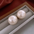 Elegant champagne pink round pearl earrings presented in a luxury gray velvet jewelry box - Champagne Large Pearl