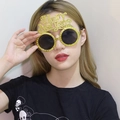 Sparkling gold Happy New Year party glasses with rhinestones worn by a female model - Gold New Year Glasses With Small Holes