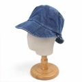 Detail view of deep blue denim bucket hat showing fabric texture and side woven label - 59cm (Adjustable) / Medium Blue & White