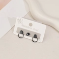 Minimalist black stainless steel earring set with circle charms and faceted studs - Double Circle Style / Black