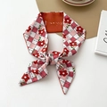 Narrow pink plaid silk scarf featuring red floral patterns and orange block accents - Argyle Small Floral