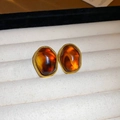 Macro shot of amber resin earrings with gold twisted metal edges in a velvet jewelry box - 8# Gold Coffee Trapezoid