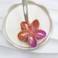 Frangipani hair claw clip with orange-to-purple gradient pearl finish and matte texture - Magenta & Orange AB