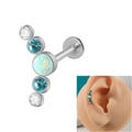 Silver 16G curved bar piercing with white opal and blue gemstones on an ear model - Curved 1 OP17+2 White+Blue Zircon