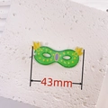 Green acrylic carnival mask charm with yellow and purple accents, 43mm width detail - Yellow and Green Mask