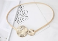 Detail of gold metal spring belt featuring irregular hammered double circle buckles - Gold Double Round Plate Buckle Spring Chain