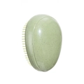 Pale green oval detangling hairbrush with speckled plastic texture on white background - Egg Shaped Brush / Green