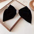 Close-up of black velvet bow hair claw with pearl rhinestone center and dangling pearls - Spring Clips / Black