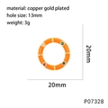 Macro view of a copper gold plated ring pendant with colorful enamel and inset zircons - Orange (P07328)