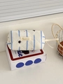 Detail of beige quilted makeup bag with blue stripes and tiny heart and star patterns - Octagonal Pouch / Blue